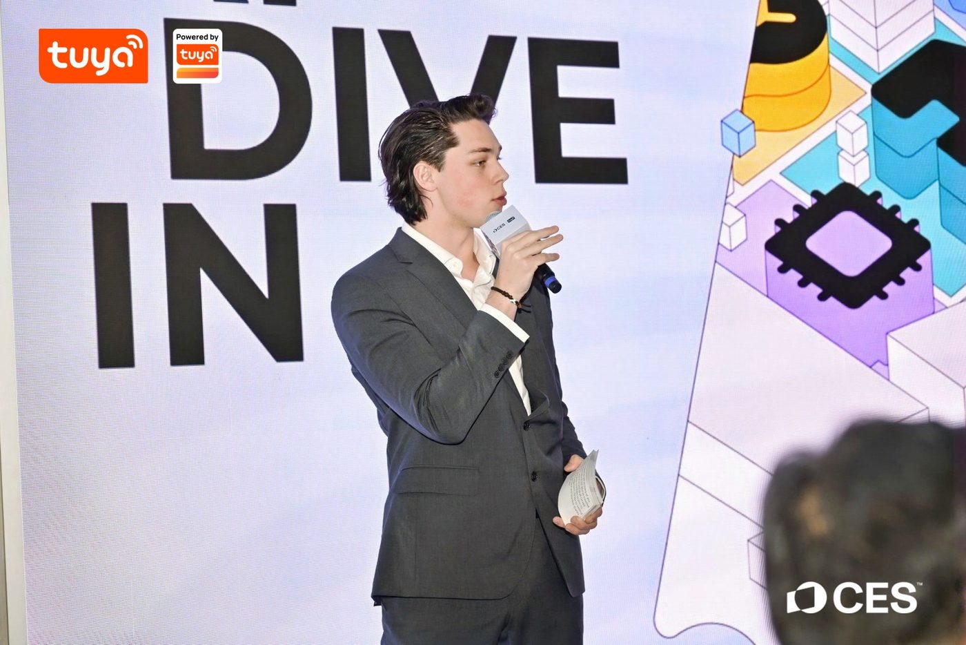 Devin Newcomb speaking at CES on AI and real estate